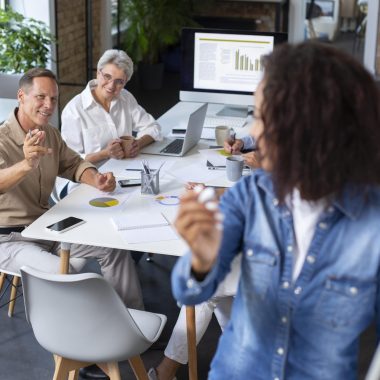 people-using-digital-device-while-meeting